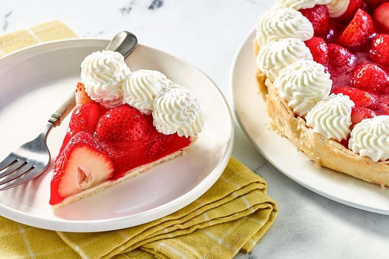 Copycat Shoney's Strawberry pie slice next to the pie.