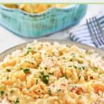 Shrimp and crab au gratin and rice on a plate.