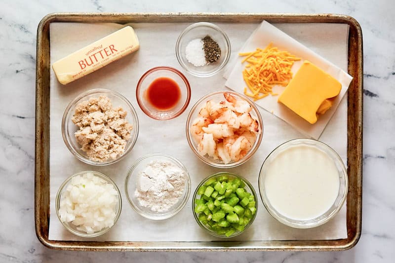 Shrimp and crab au gratin ingredients on a tray.