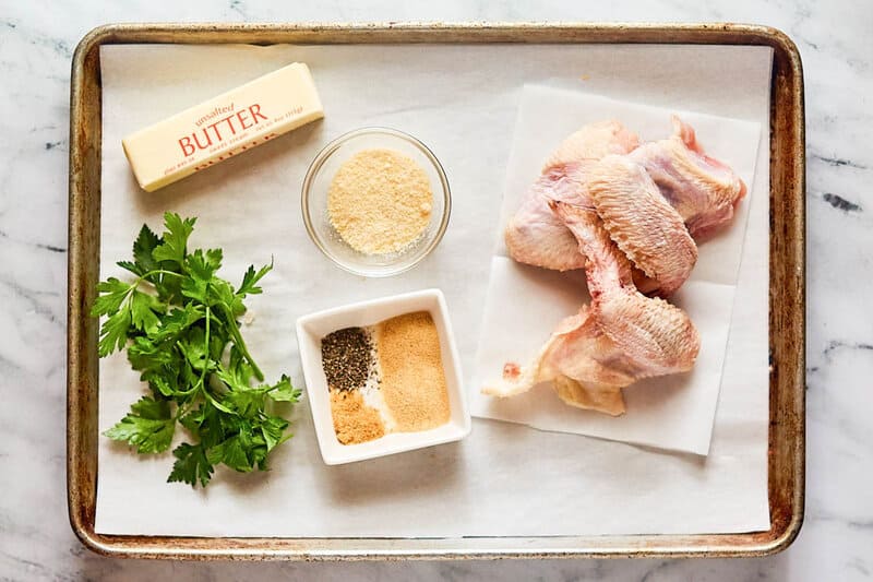 Copycat Wingstop garlic parmesan wings ingredients on a tray.
