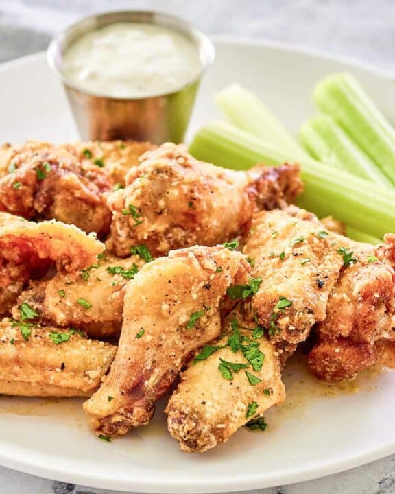 Copycat Wingstop garlic parmesan wings on a plate.