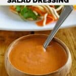 Homemade Benihana ginger salad dressing and a salad behind it.