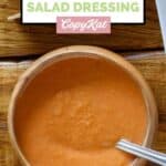 Homemade Benihana salad dressing and a spoon in a bowl.