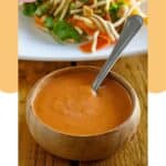 A bowl of homemade Benihana ginger salad dressing and a salad.