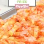 Homemade In-N-Out animal style fries on a baking sheet.