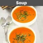 Homemade La Madeleine tomato basil soup and two spoons.
