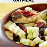 Copycat McDonald's fruit and maple oatmeal on a spoon held over a bowl of it.