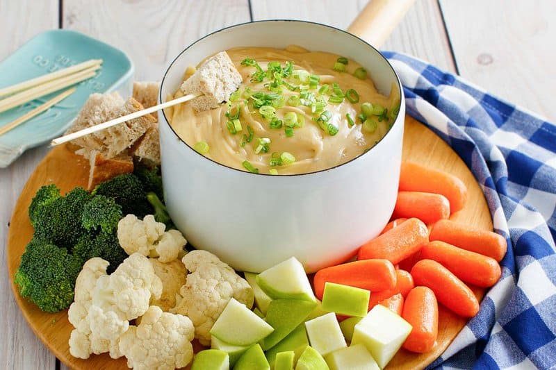 Copycat Melting Pot Wisconsin trio cheese fondue, bread cubes, veggies, and apples.