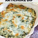 Homemade Olive Garden spinach artichoke dip in a ceramic baking dish.