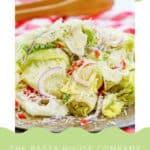 Copycat Pasta House Company salad with dressing on a plate.