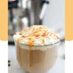 Homemade Starbucks caramel latte in a glass coffee mug.
