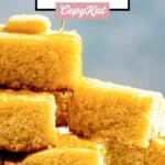 Slices on homemade Tippin's cornbread stacked on a plate.
