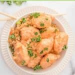 A bowl of air fryer bang bang shrimp over fried rice.