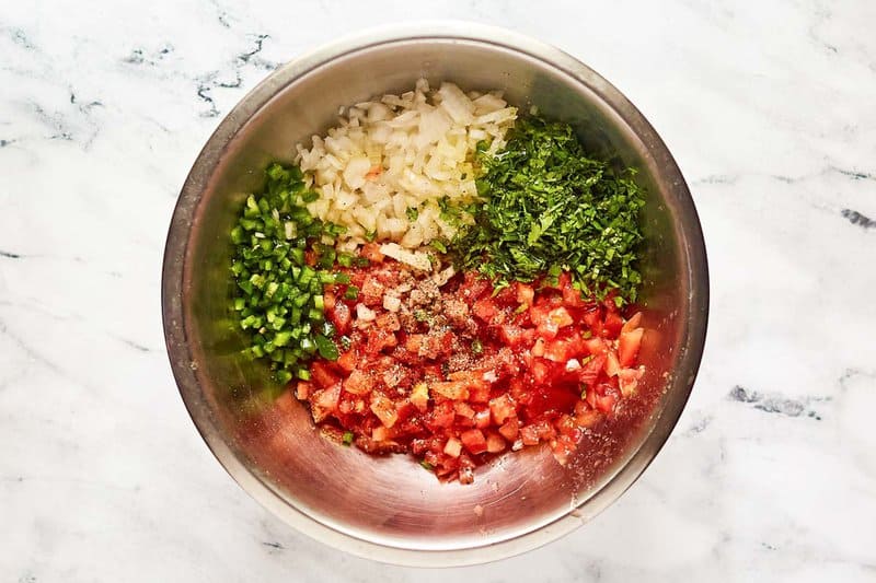 Copycat Applebee's pico de gallo ingredient in a mixing bowl.