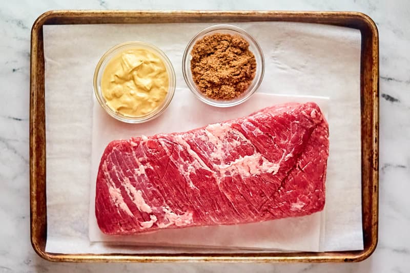 Baked corned beef ingredients on a tray.