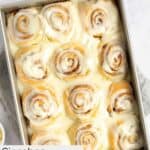 Homemade Cinnabon cinnamon rolls in a baking pan.