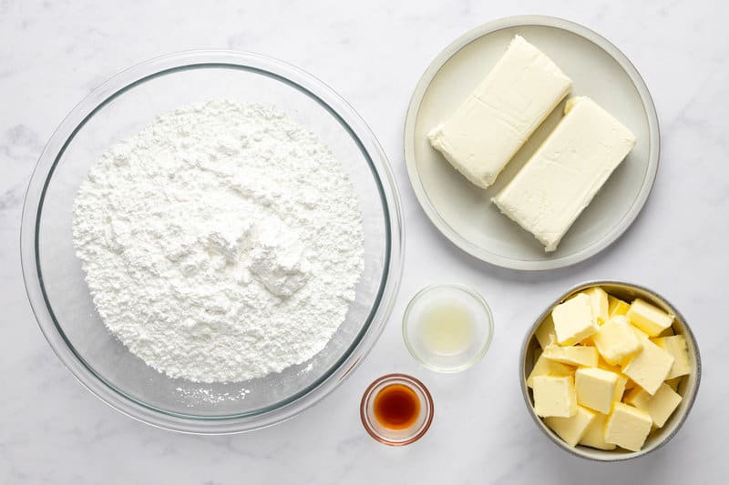 Cinnabon cream cheese frosting ingredients in bowls.