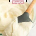 Homemade Cinnabon frosting on a spatula.