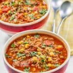 Cowboy soup garnished with fresh parsley.