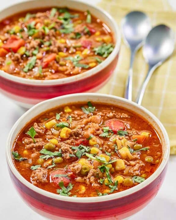 Cowboy soup garnished with fresh parsley.