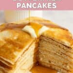 Homemade IHOP buttermilk pancakes on a plate and cut to show the inside of the stack.