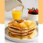 Pouring syrup over homemade IHOP buttermilk pancakes.