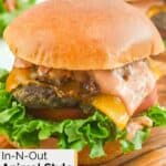 Homemade In and Out animal style burger on a wood board.