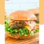 Homemade animal style burger on a wood board.