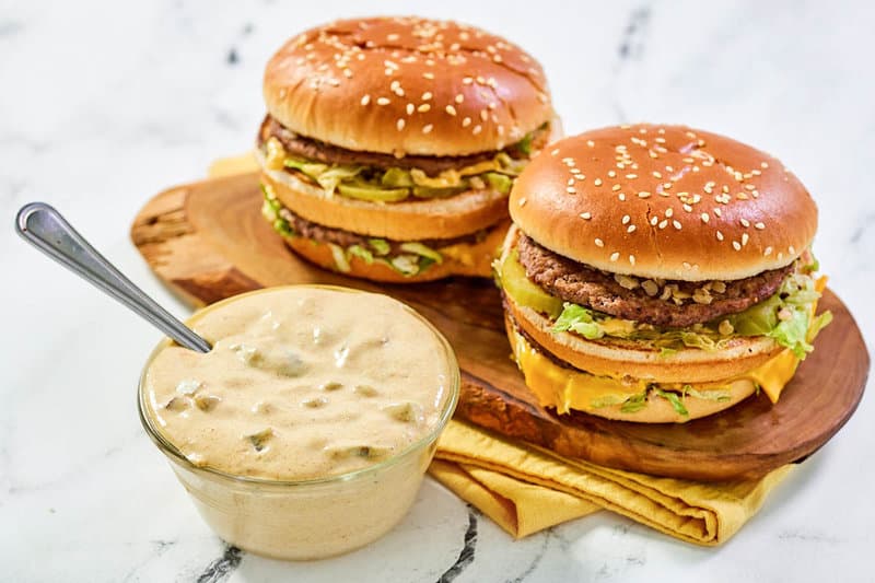 Copycat McDonald's big mac sauce and two big mac burgers.