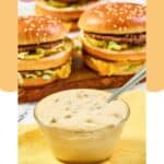 A bowl of homemade big mac sauce and big mac burgers behind it.