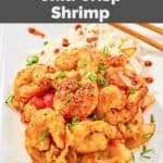 Homemade Panda Express chili crisp shrimp and steamed white rice on a plate.