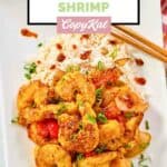 Homemade Panda Express chili crisp shrimp and rice on a large plate.