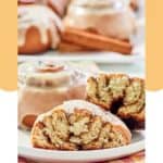 Two homemade Panera cinnamon rolls on a plate and one cut in half.