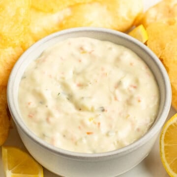 A bowl of copycat Red Lobster tartar sauce and fried fish on a plate.