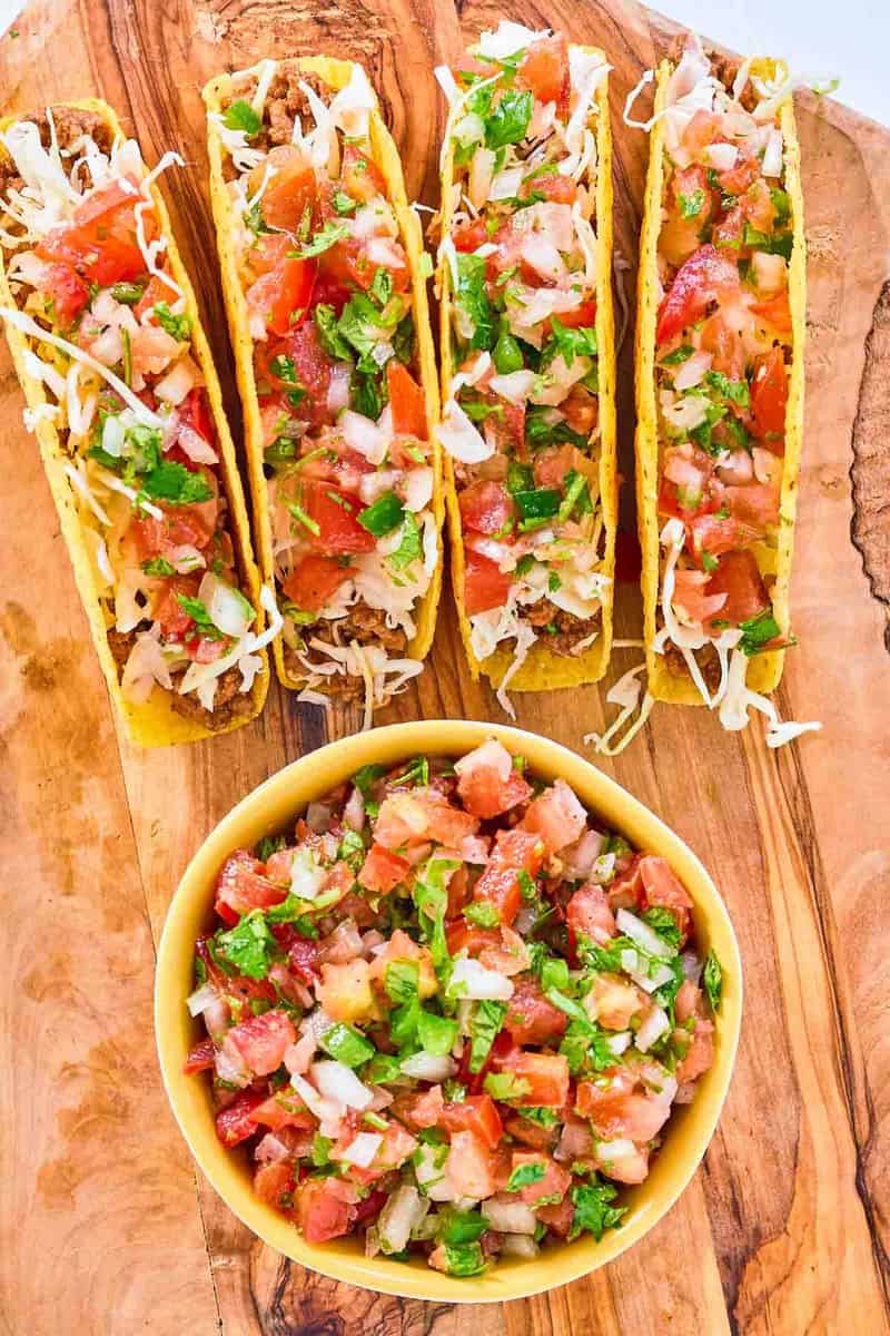 Copycat Applebee's pico de gallo in a bowl and on tacos.