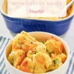 A bowl of baked cauliflower with cheese sauce.