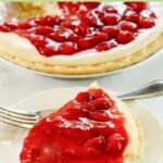 Cherry cream cheese pie slice and a fork on a plate.