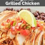 Copycat Chili's margarita grilled chicken slices over black beans and Mexican rice.