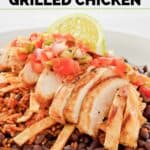 Copycat Chili's margarita grilled chicken sliced and over black beans and Mexican rice.