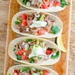 Copycat Chipotle carnitas in tacos.