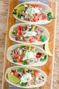 Copycat Chipotle carnitas in tacos.