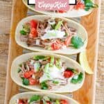 Four soft tacos made with homemade Chipotle carnitas.