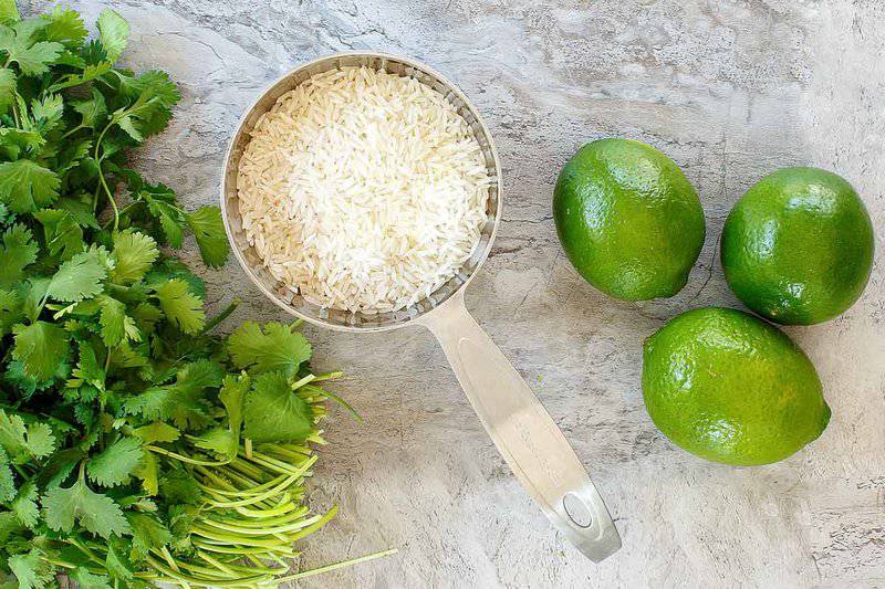 Copycat Chipotle cilantro lime rice ingredients on a marble surface.