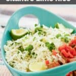Homemade Chipotle cilantro lime rice and fresh lime wedges in a bowl.