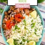 Homemade Chipotle cilantro lime rice, lime wedges, and steak bites in a bowl.