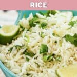 Homemade Chipotle cilantro lime rice and lime wedges in a bowl.