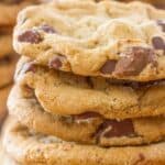 Four chocolate chippers in a stack.