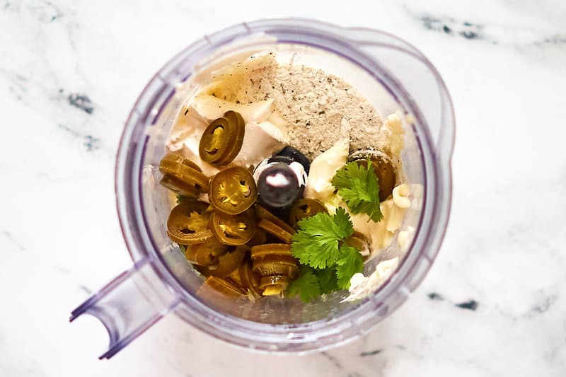 Copycat Chuy's creamy jalapeno dip ingredients in a blender.