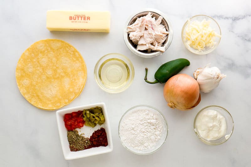 King ranch casserole ingredients on a marble surface.