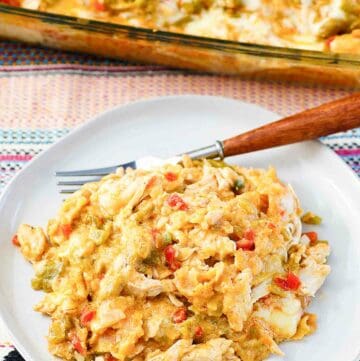 King ranch casserole in a baking dish and a serving on a plate.
